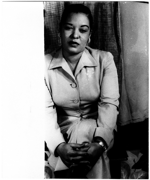 A black and white photo of Billie Holiday.